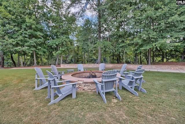 view of yard with an outdoor fire pit