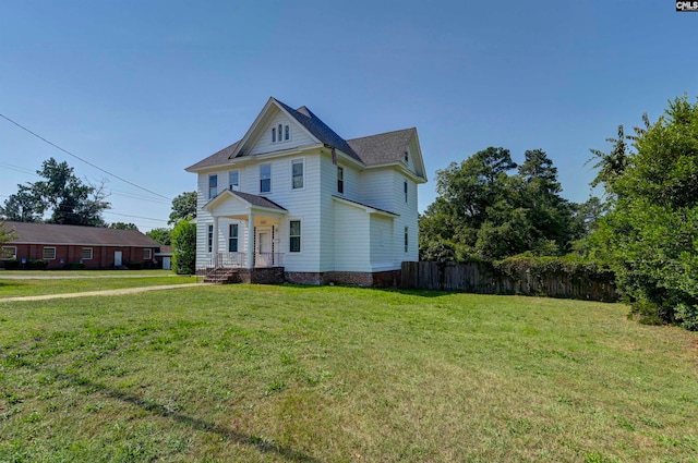 victorian home featuring a front yard