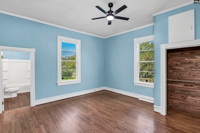 unfurnished bedroom with ceiling fan, connected bathroom, ornamental molding, a closet, and dark hardwood / wood-style flooring