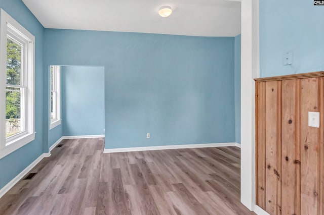 spare room with light hardwood / wood-style floors