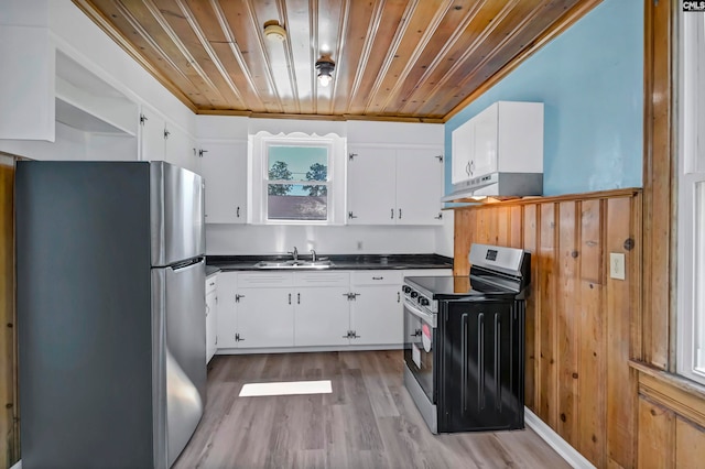 kitchen featuring stainless steel appliances, light wood-type flooring, and white cabinetry