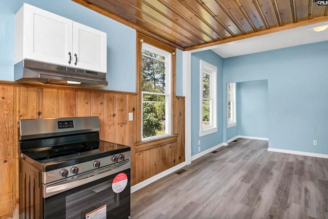 kitchen featuring white cabinets, stainless steel gas stove, wooden ceiling, and light hardwood / wood-style flooring