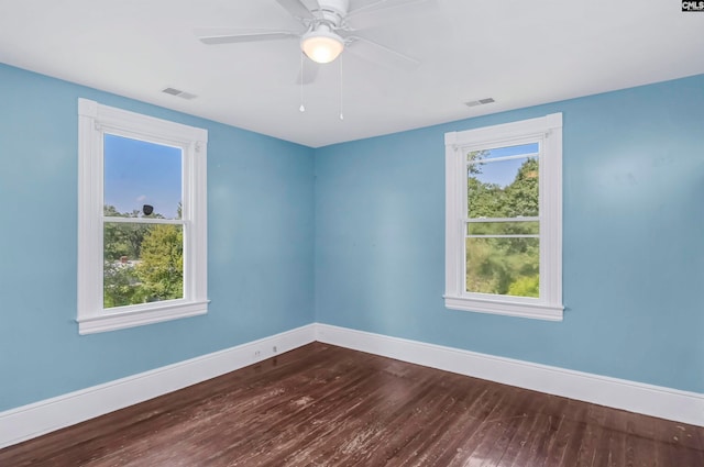 unfurnished room with ceiling fan and wood-type flooring