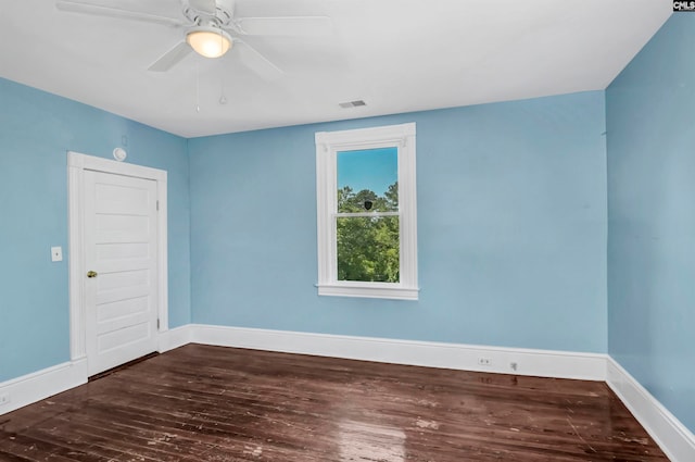 unfurnished room with ceiling fan and dark hardwood / wood-style floors