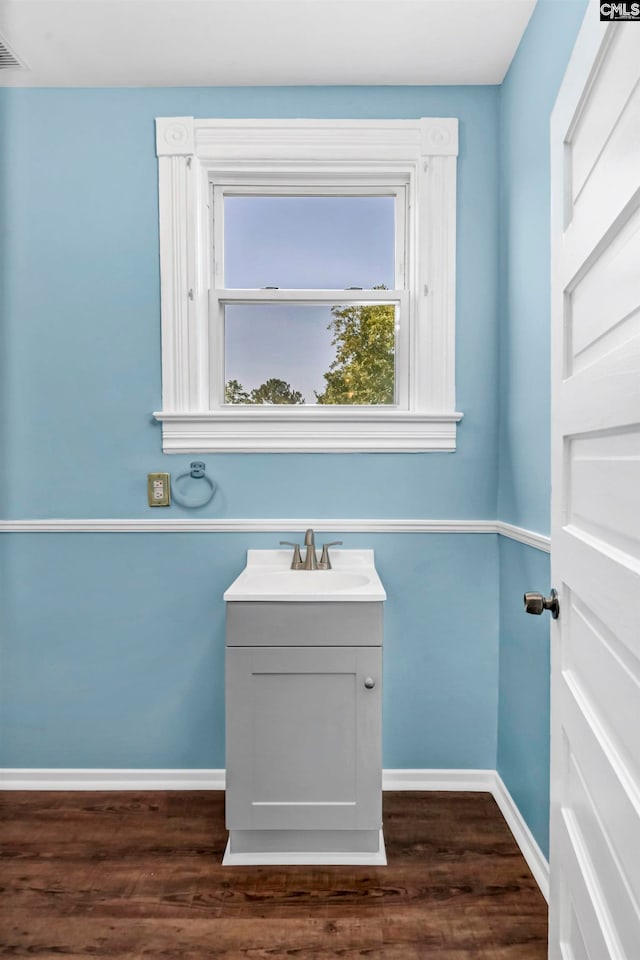 bathroom featuring vanity and hardwood / wood-style flooring