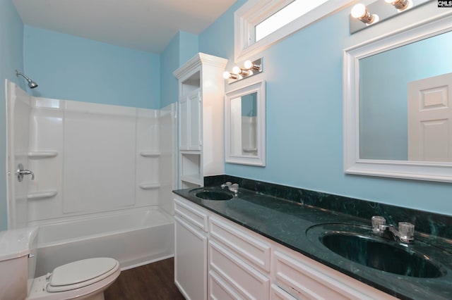 full bathroom featuring bathing tub / shower combination, vanity, toilet, and wood-type flooring