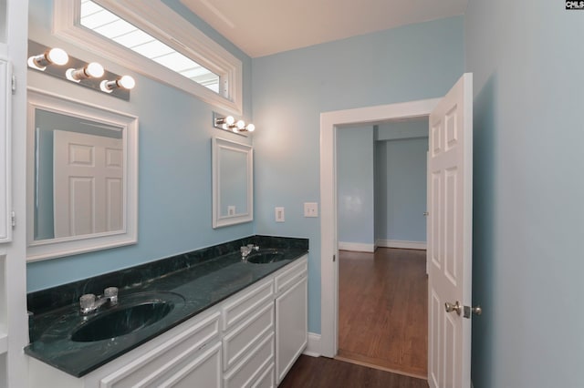 bathroom featuring vanity and hardwood / wood-style flooring