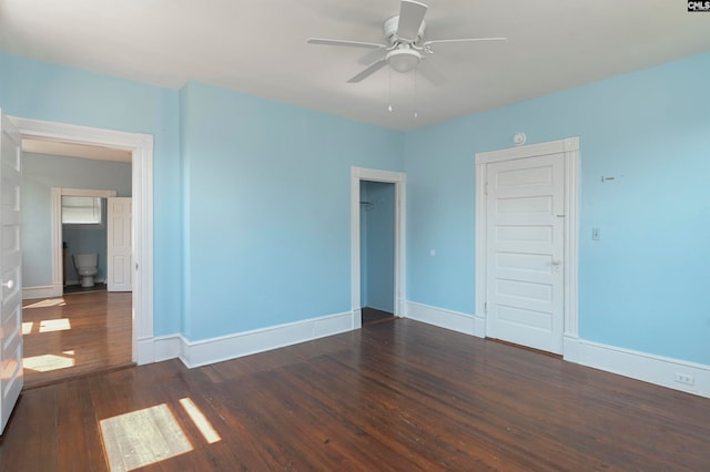 spare room featuring ceiling fan and dark hardwood / wood-style flooring