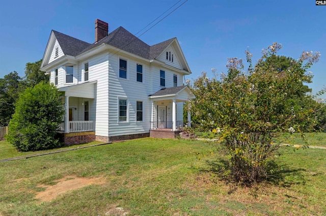 view of home's exterior featuring a yard and a porch