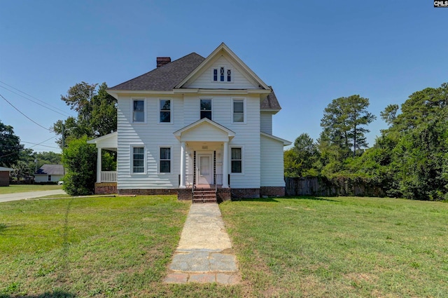 view of front of home with a porch and a front lawn