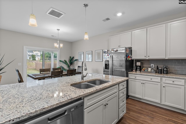 kitchen featuring appliances with stainless steel finishes, sink, dark hardwood / wood-style flooring, and white cabinets