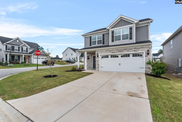 view of front of property with a front lawn and a garage