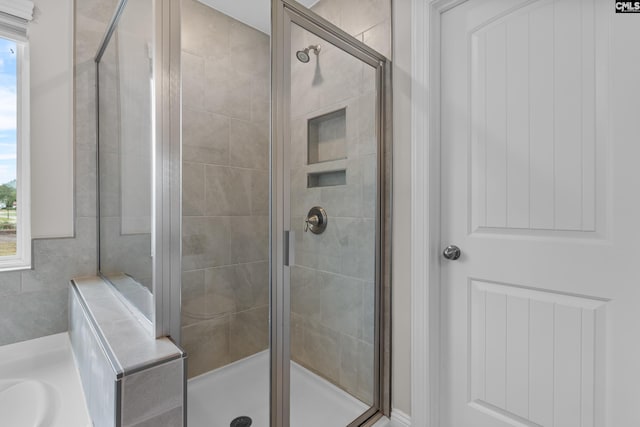 bathroom with a shower with shower door