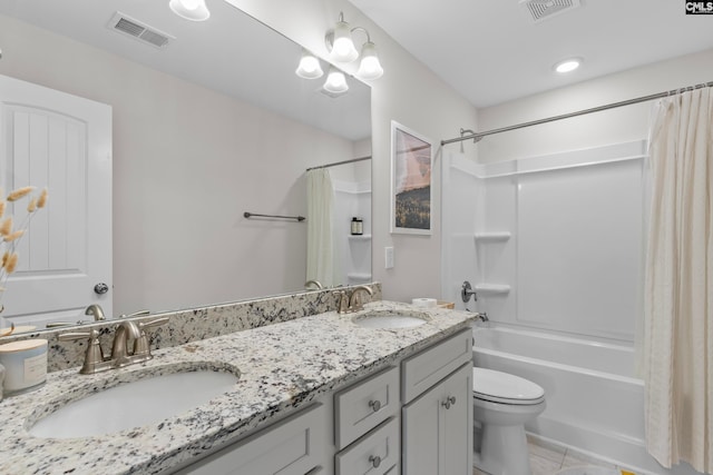 full bathroom with shower / bath combination with curtain, vanity, tile patterned flooring, and toilet