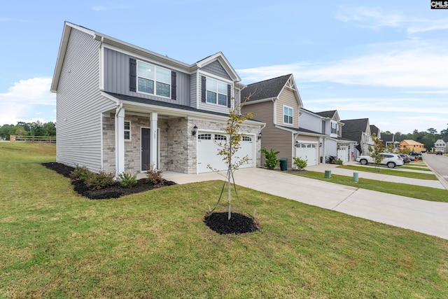 view of front of home with a garage and a front lawn