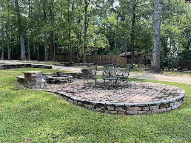 exterior space with a patio area and a fire pit