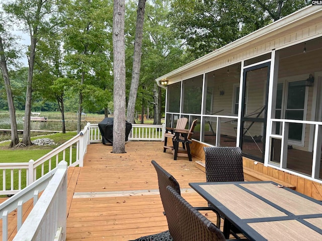 wooden terrace with a sunroom