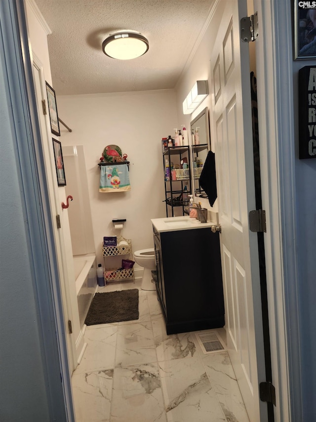 full bathroom featuring toilet, a textured ceiling, ornamental molding, vanity, and shower / bath combination