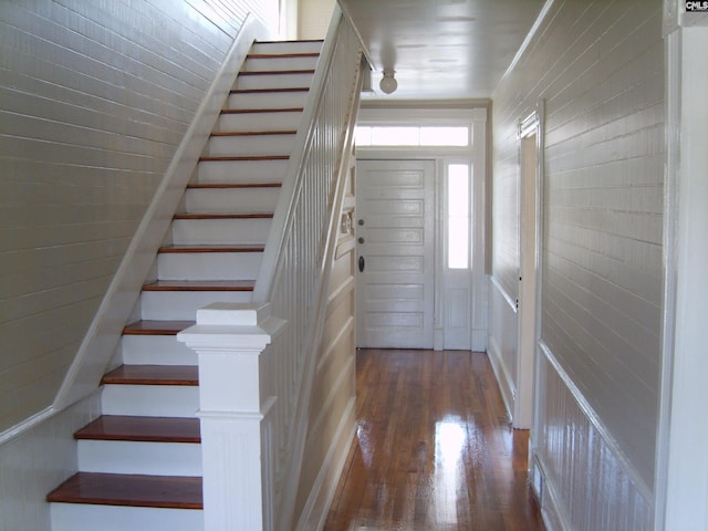 foyer entrance with dark wood-type flooring