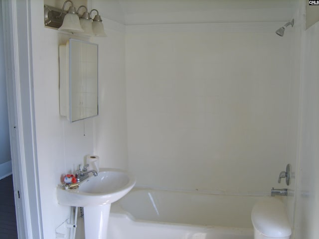 bathroom featuring toilet and  shower combination