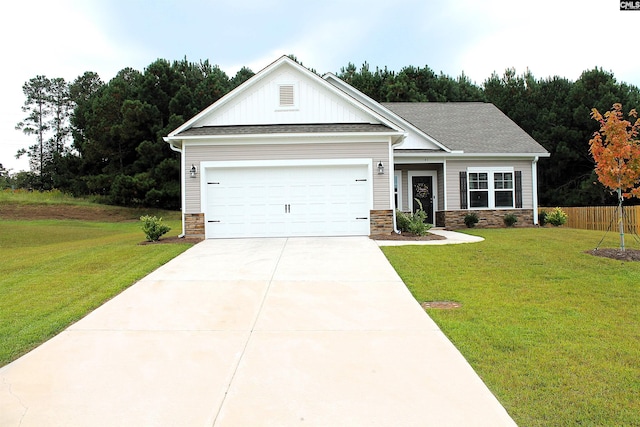 view of front of property featuring a garage and a front yard