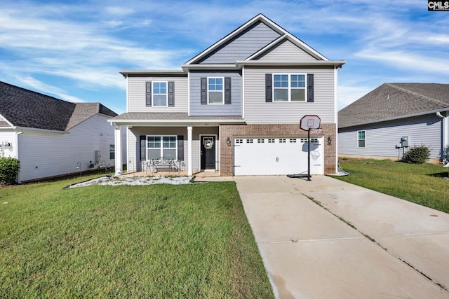 view of front of house with a front yard, a garage, and covered porch