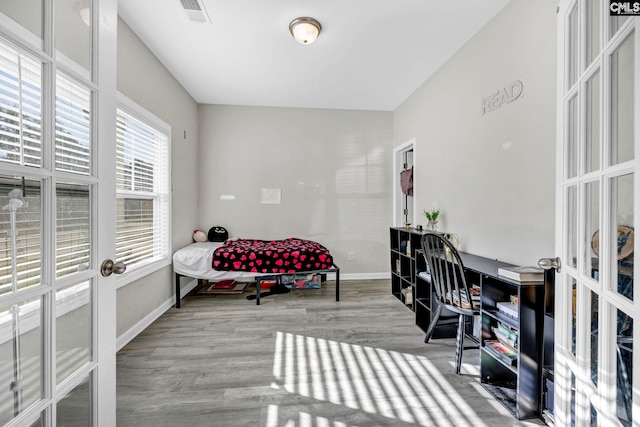 office featuring light hardwood / wood-style flooring and french doors