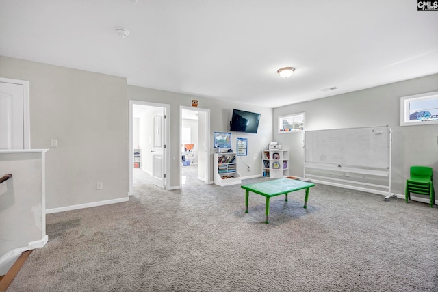 recreation room featuring carpet floors and plenty of natural light