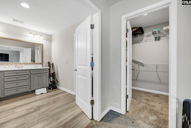 bathroom featuring vanity and hardwood / wood-style flooring