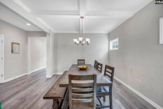 dining space featuring wood-type flooring and ornamental molding