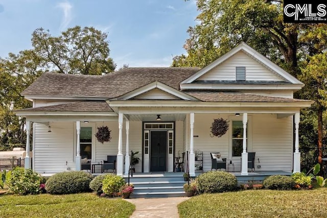 bungalow-style house with a porch and a front lawn