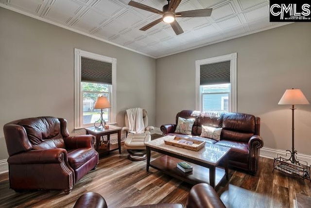 living room with ornamental molding, ceiling fan, and hardwood / wood-style flooring