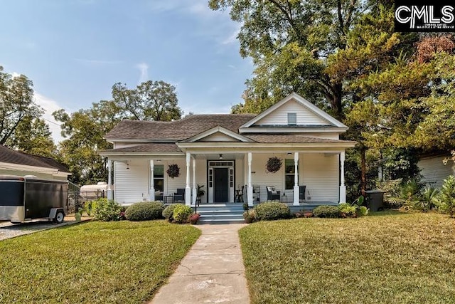 bungalow with a front lawn and covered porch