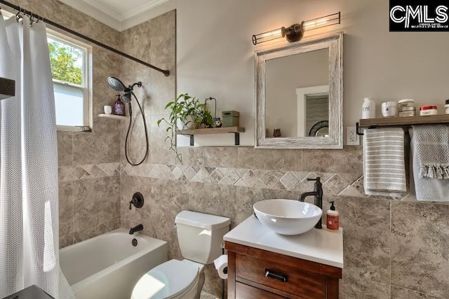 full bathroom featuring shower / tub combo, crown molding, vanity, and toilet