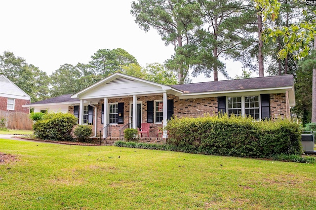 view of front of house with a porch and a front lawn