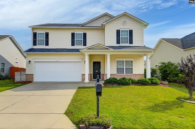 view of front of house with a front lawn, a porch, and a garage