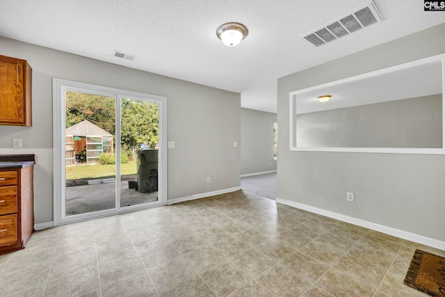 interior space with a textured ceiling