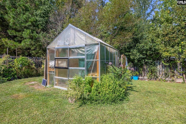 view of outbuilding featuring a yard