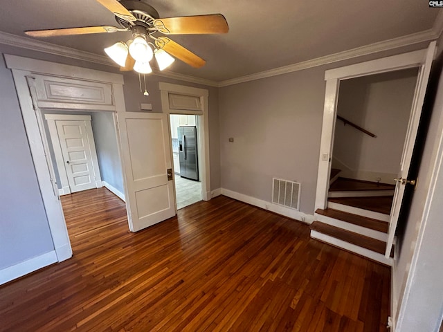 unfurnished bedroom featuring dark hardwood / wood-style flooring, a closet, crown molding, ceiling fan, and stainless steel fridge with ice dispenser