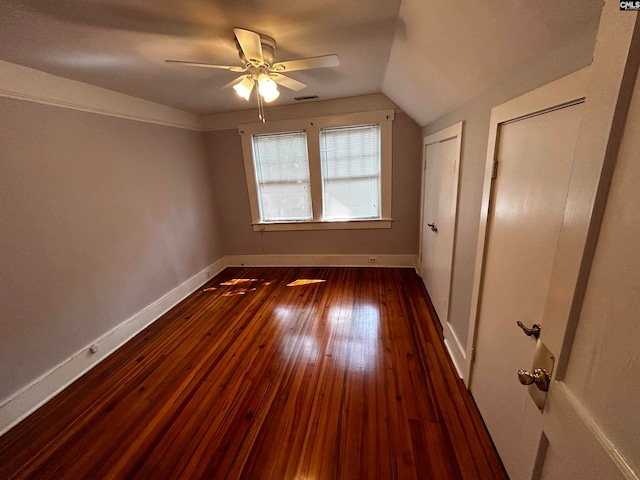 additional living space with lofted ceiling, ceiling fan, and dark hardwood / wood-style floors