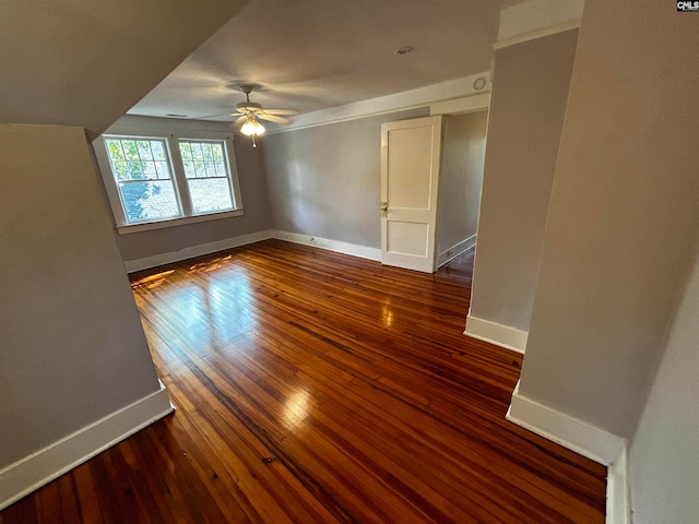 spare room featuring ceiling fan and dark hardwood / wood-style floors