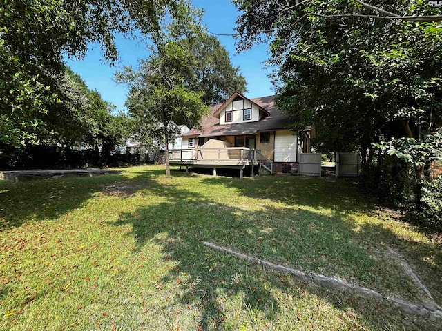 view of yard featuring a wooden deck