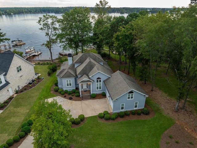 birds eye view of property with a water view