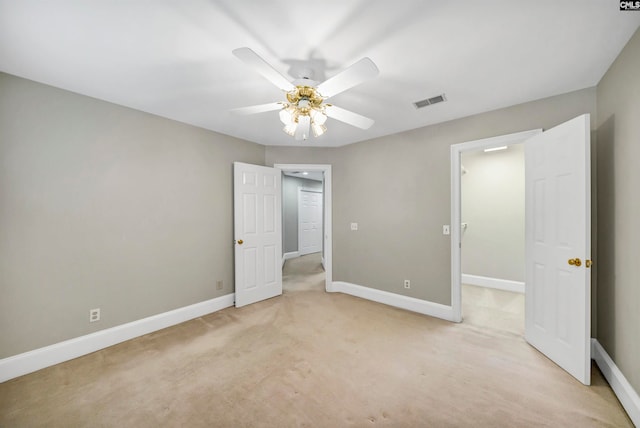 unfurnished bedroom featuring ceiling fan and light colored carpet