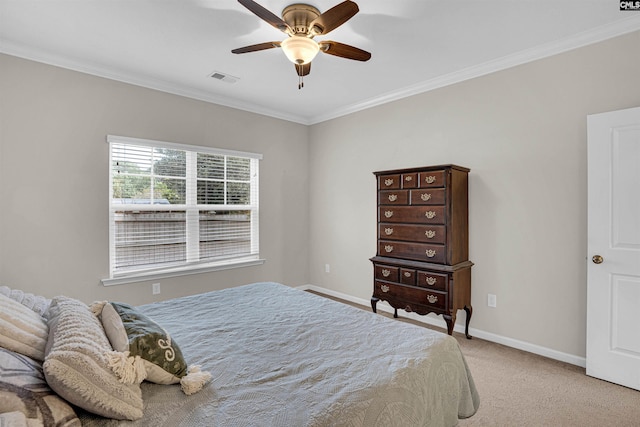 bedroom with ceiling fan, light colored carpet, and ornamental molding