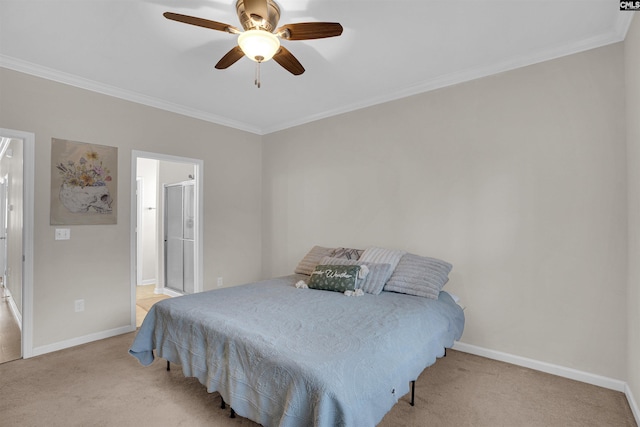 carpeted bedroom with crown molding, ensuite bath, and ceiling fan