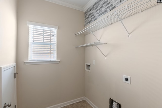 laundry area with ornamental molding, hookup for an electric dryer, hookup for a washing machine, and light tile patterned floors