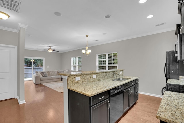 kitchen with sink, light hardwood / wood-style flooring, decorative light fixtures, black appliances, and ceiling fan with notable chandelier