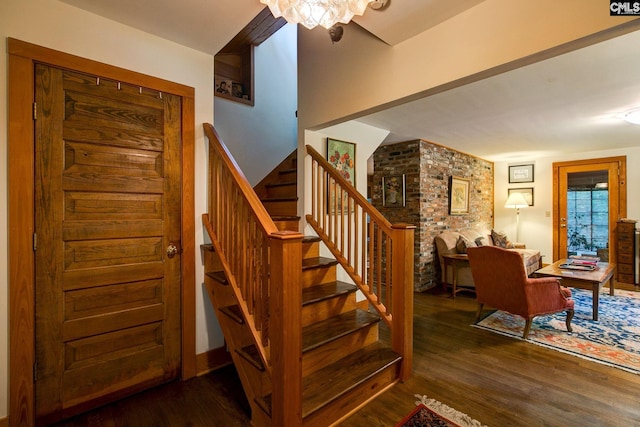 stairs with wood-type flooring