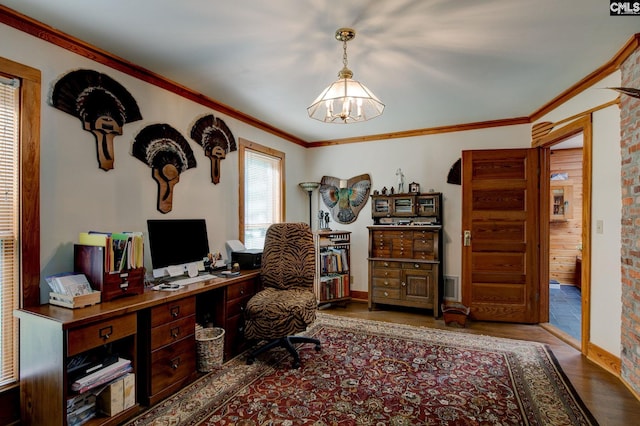 office featuring a notable chandelier, ornamental molding, and hardwood / wood-style floors